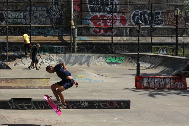 A photo of a skateboarder mid-air on the Lower East Side